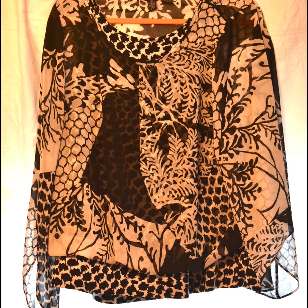 Women’s black & white blouse with underlying tank.